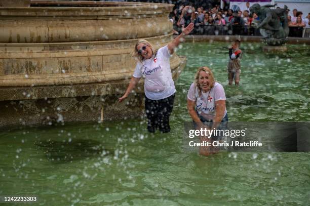 England football fans celebrate in Trafalgar Square at full time as England win the UEFA Euro womens championship final on July 31, 2022 in London,...