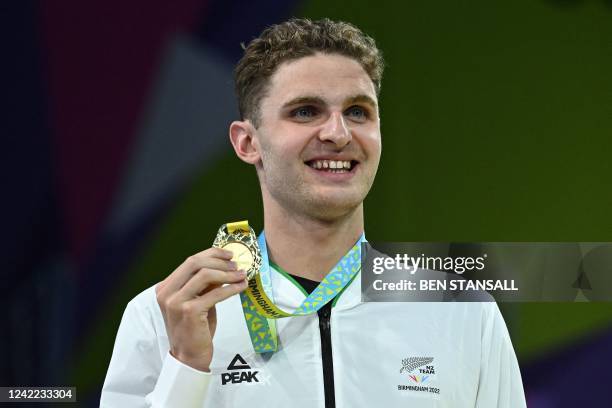 Gold medallist New Zealand's Lewis Clareburt poses during the medal presentation ceremony for the men's 200m butterfly swimming final at the Sandwell...