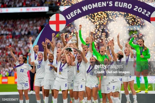 The players of England celebrate with the trophy after the UEFA Women's Euro England 2022 final match between England and Germany at Wembley Stadium...