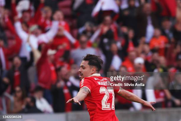 Mauricio of Internacional celebrates after scoring the third goal of his team during the match between Internacional and Atletico Mineiro as part of...