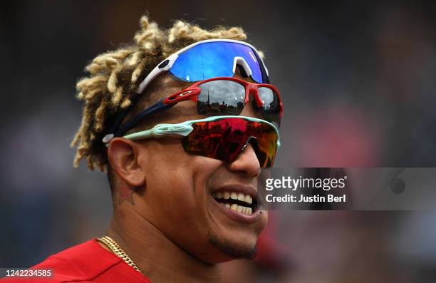 Yairo Munoz of the Philadelphia Phillies looks on from the dugout while wearing three pairs of sunglasses during the game against the Pittsburgh...