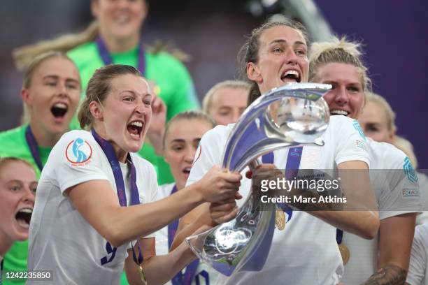 Jill Scott and Ellen White of England celebrate with the trophy during the UEFA Women's Euro England 2022 final match between England and Germany at...