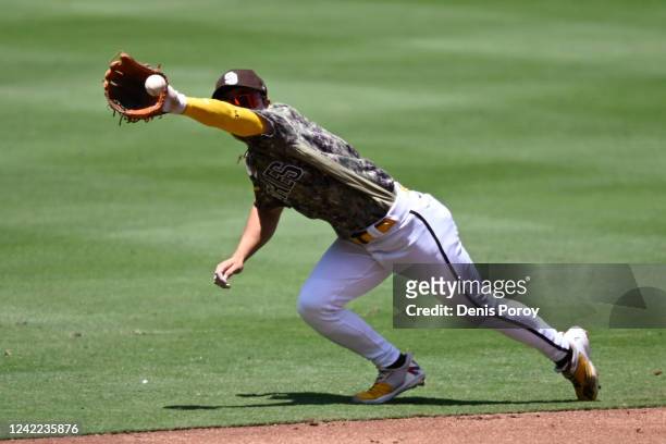 Ha-Seong Kim of the San Diego Padres makes a diving catch on a ball hit by Byron Buxton of the Minnesota Twins during the third inning of a baseball...