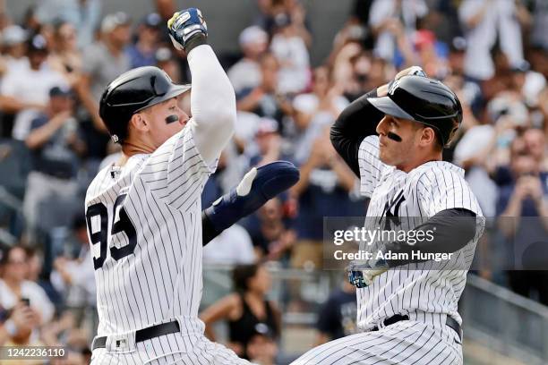 Anthony Rizzo of the New York Yankees celebrates hitting a 3-run home run with Aaron Judge of the New York Yankees against the Kansas City Royals...