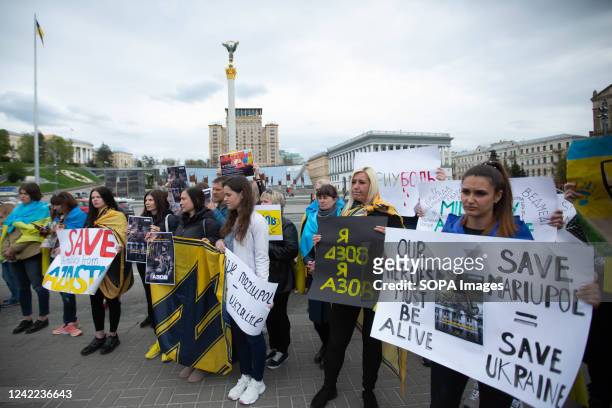 Relatives of Ukrainian prisoners of war hold placards expressing their opinion, during a rally demanding that the international community assists in...