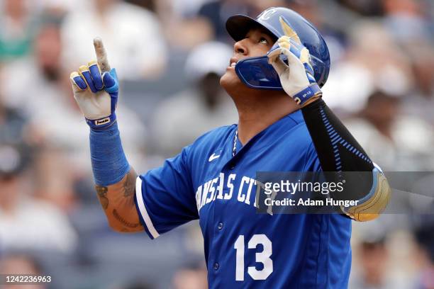 Salvador Perez of the Kansas City Royals react after hitting a 3-run home run against the New York Yankees during the ninth inning at Yankee Stadium...