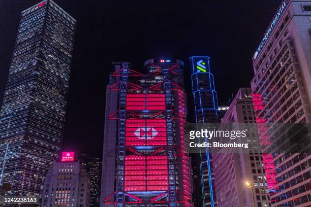 The HSBC Holdings Plc headquarters building, center, at night in Hong Kong, China, on Friday, July 29, 2022. HSBC is scheduled to release earnings...
