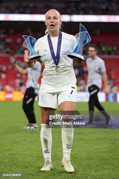 Beth Mead of England poses with her player of the tournament and top scorer awards during the UEFA Women's Euro England 2022 final match between...