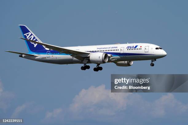 An aircraft operated by All Nippon Airways Co. Approaches Haneda Airport in Tokyo, Japan, on Sunday, July 31, 2022. All Nippon Airways is scheduled...