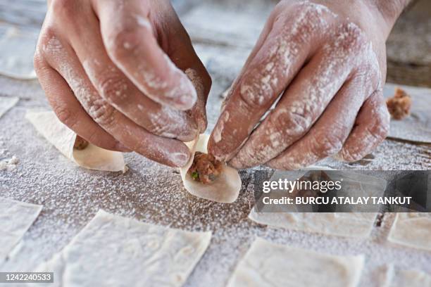 hands shaping tortellini - homemade pasta stock pictures, royalty-free photos & images