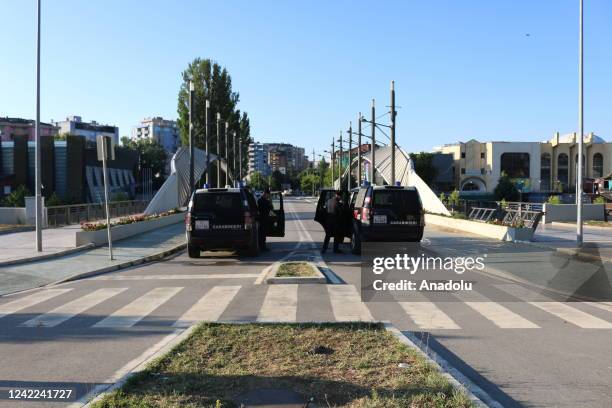 Members of Kosovo Force take measures at a checkpoint after Kosovo decided to postpone the implementation of a new law set to come into effect Monday...