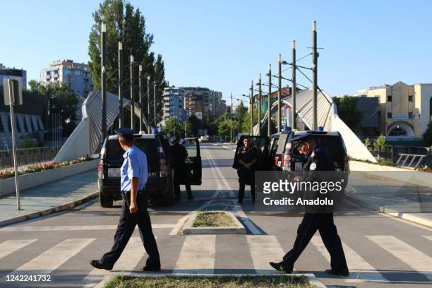 Members of Kosovo Force take measures at a checkpoint after Kosovo decided to postpone the implementation of a new law set to come into effect Monday...