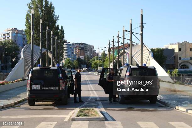 Members of Kosovo Force take measures at a checkpoint after Kosovo decided to postpone the implementation of a new law set to come into effect Monday...