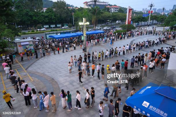 This photo taken on July 31, 2022 shows residents queueing to undergo nucleic acid tests for the Covid-19 coronavirus at a swab collection site in...