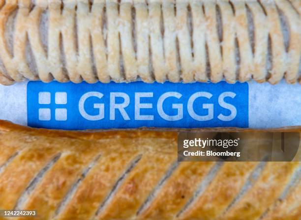 Vegan sausage roll and a sausage roll from a Greggs Plc store on top of packaging arranged in London, UK, on Friday, July 29, 2022. Greggs will...