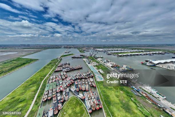 This aerial photo taken on August 1, 2022 shows fishing boats preparing to head out to sea on the first day of the fishing season in the Yellow Sea...