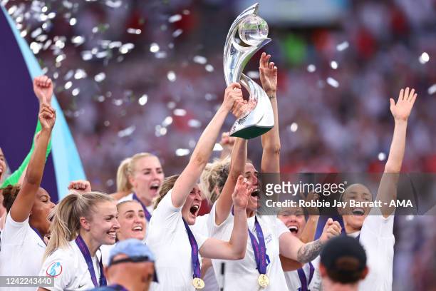Ellen White and Jill Scott of England Women lift the trophy during the UEFA Women's Euro England 2022 final match between England and Germany at...