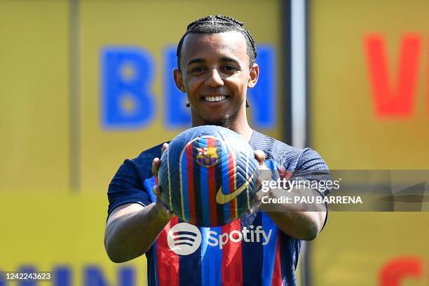 Barcelona's new french defender Jules Kounde poses for pictures during his presentation ceremony at the Joan Gamper training ground in Sant Joan...