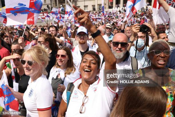 Football fans cheer during a victory party in Trafalgar Square in central London on August 1 a day after England beat Germany 2-1 to win the Women's...