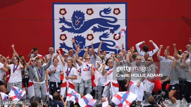 England's players celebrate during a victory party in Trafalgar Square in central London on August 1 a day after they beat Germany 2-1 to win the...