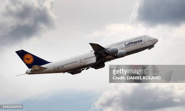 Lufthansa Boeing 747 is pictured overhead at the airport in Frankfurt am Main, western Germany, on August 1, 2022. Pilots at Lufthansa, Europe's...