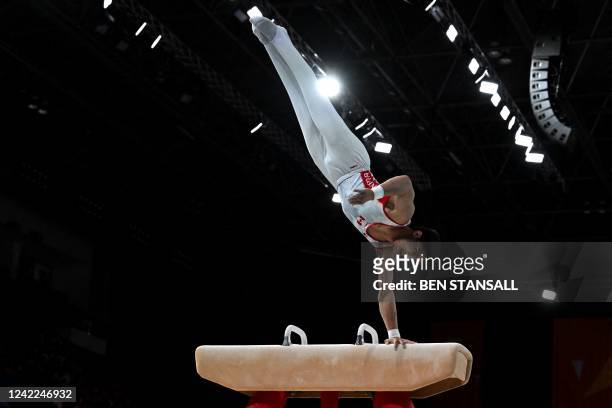 Canada's Jayson Rampersad competes for third place and to take the bronze medal in the men's pommel horse final artistic gymnastics event at the...