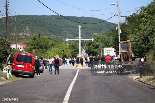 Trucks are seen on the road in Zvecan town near the Jarinje Border Crossing in Mitrovica, Kosovo on August 01, 2022. Some barricades and trucks...