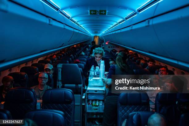 Flight attendants serve refreshments on a Delta Airlines flight from Hartsfield-Jackson International Airport on Monday, Aug. 1, 2022 in Atlanta, GA.