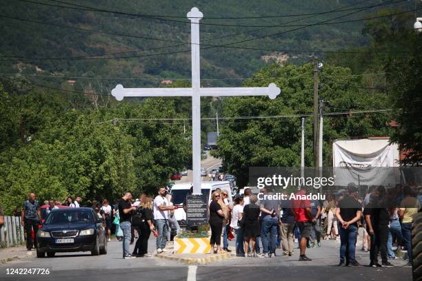 Trucks are seen on the road in Zvecan town near the Jarinje Border Crossing in Mitrovica, Kosovo on August 01, 2022. Some barricades and trucks...