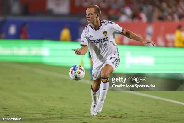 Los Angeles Galaxy defender Chase Gasper advances the ball during the match between FC Dallas and LA Galaxy on July 30, 2022 at Toyota Stadium in...