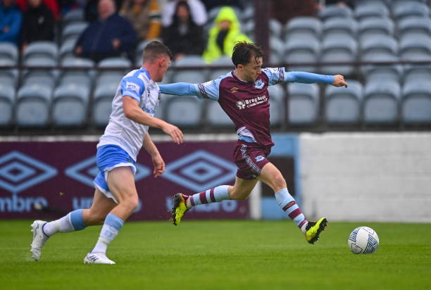 Louth , Ireland - 1 August 2022; Darragh Markey of Drogheda United in action against Michael Gallagher of UCD during the SSE Airtricity League...