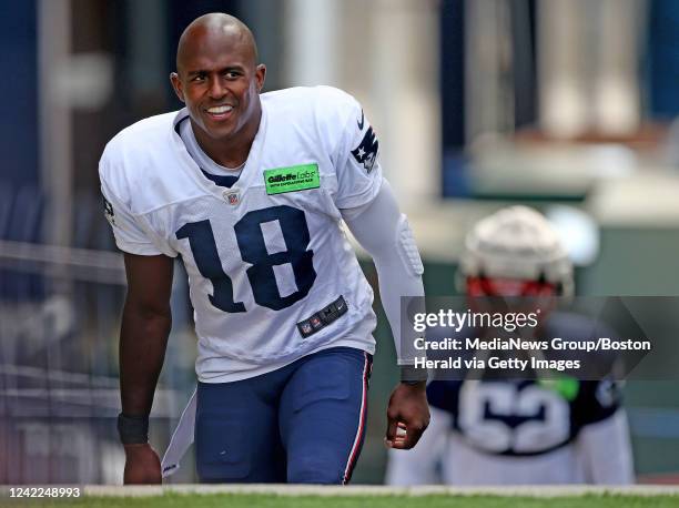 August 1: Matthew Slater of New England Patriots walks to the field during training camp on August 1, 2022 in Foxboro, Massachusetts.