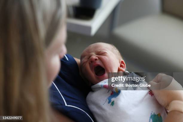 Concord, MA A newborn baby boy yawns as he sits with his mother at Emerson Hospital. Births rebounded to pre-pandemic levels in Massachusetts, rising...