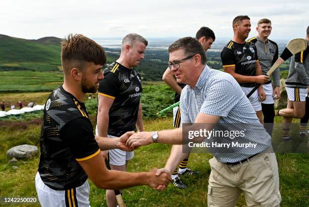Louth , Ireland - 1 August 2022; Ard Stiúrthóir of the GAA Tom Ryan presents a sliotar to Colin Ryan of Limerick during the M. Donnelly GAA...