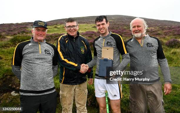 Louth , Ireland - 1 August 2022; Darren Geoghegan of Louth with, from left, National Poc Fada Committee Cathaoirleach Tom Ryan, Ard Stiúrthóir of the...