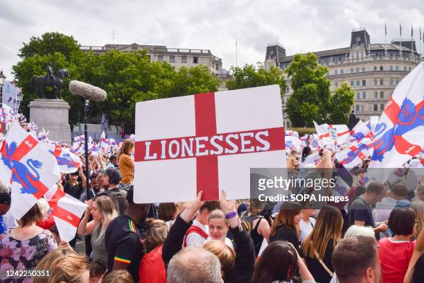 Fan holds a sign in support of the Lionesses with the colours of the England flag during the Women's Euro 2022 special event in Trafalgar Square....
