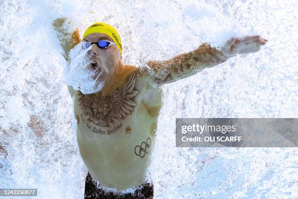 Australia's Kyle Chalmers competes to win and take the gold medal in the men's 100m freestyle swimming final at the Sandwell Aquatics Centre, on day...
