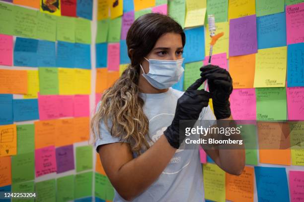 Healthcare worker prepares a dose of the Novavax Covid-19 vaccine at a pharmacy in Schwenksville, Pennsylvania, US, on Monday, Aug. 1, 2022....