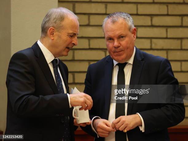 Taoiseach Micheal Martin and Minister of State for Northern Ireland Conor Burns are seen after the funeral of former Northern Ireland first minister...