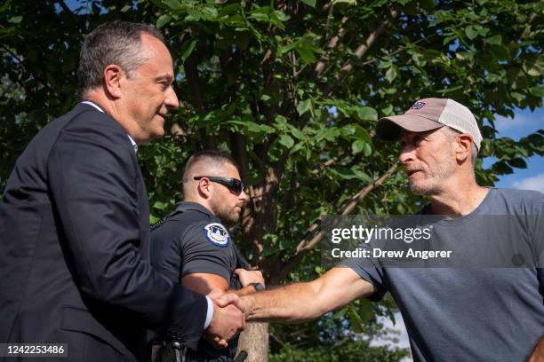 Second gentleman Doug Emhoff shakes hands with comedian and activist Jon Stewart as Emhoff stopped to greet veterans and families in support of the...