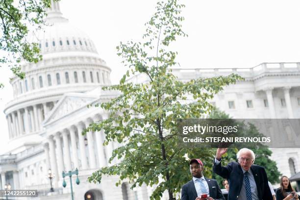 Senator Bernie Sanders waves to veterans outside the US Capitol in Washington, DC, on August 1, 2022. - Veterans and supporters have been gathering...