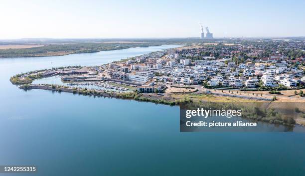 July 2022, Saxony, Zwenkau: A harbor and new residential buildings were built at Cape Zwenkau on the lake of the same name . The former open-cast...