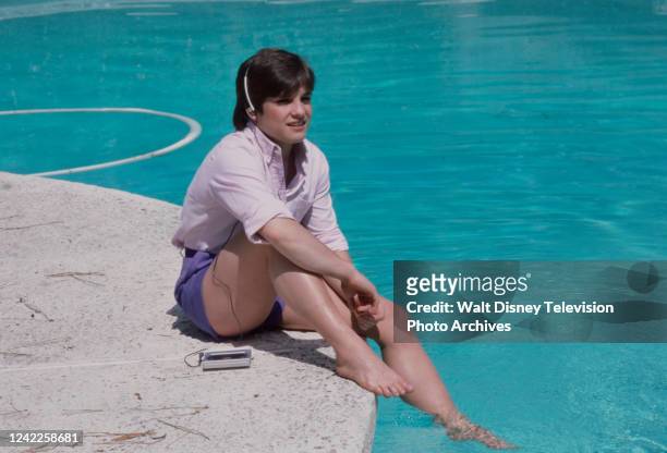 Mary Lou Retton at home by the pool relaxing, appearing on the ABC Sports tv special 'Mary Lou Retton and Julie Ann McNamara'.