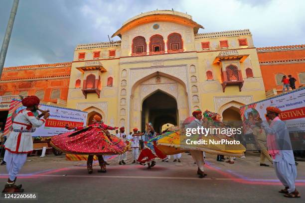 Folk artists perform during the traditional procession makes its way on the occasion of 'Teej' festival in Jaipur, Rajasthan, India, Aug 01,2022.