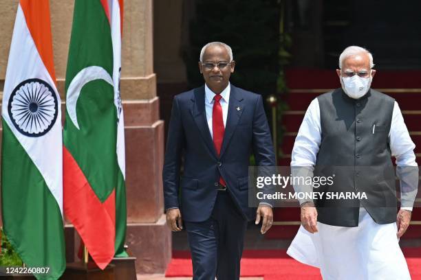 Indias Prime Minister Narendra Modi and Maldives' President Ibrahim Mohamed Solih walk before their meeting at the Hyderabad House in New Delhi on...