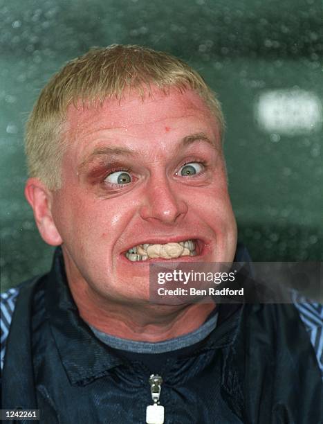 Paul Gascoigne of Great Britain pulls a face as he sits on the subs bench during the Hong Kong XI v England match played in Hong Kong. England won...