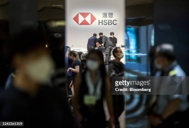 Staff prepares ahead of an HSBC Holdings Plc informal shareholders meeting in Hong Kong, China, on Tuesday, Aug. 2, 2022. HSBC executives and...