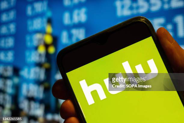 In this photo illustration, the American global on-demand Internet streaming media provider, Hulu logo is displayed on a smartphone screen.