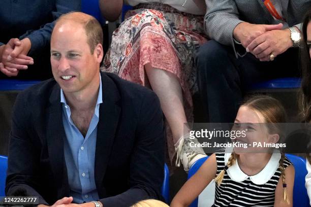 The Duke of Cambridge with Princess Charlotte of Cambridge at Sandwell Aquatics Centre on day five of the 2022 Commonwealth Games in Birmingham....