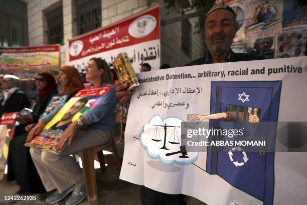 People demonstrate in support of Palestinian prisoners in Israeli jails, outside the International Committee of the Red Cross headquarters in...